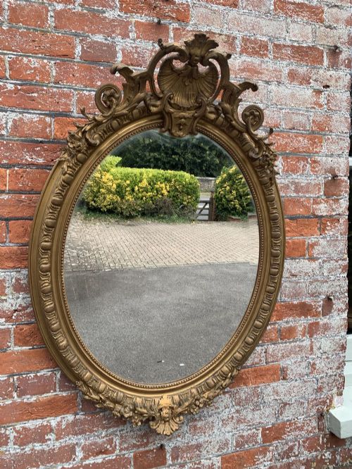 A Delightful Good Size Antique French 19th Century Carved Wood and Gesso Original Gilt Oval Mirror.