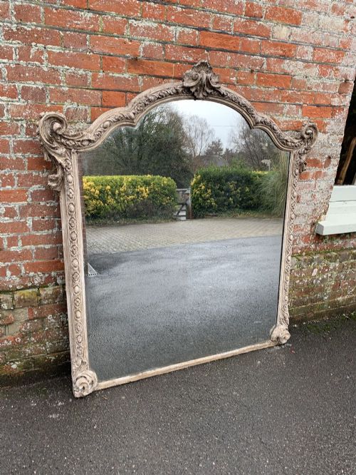 A Superb Large Antique French 19th Century Carved Wood and Gesso Shaped Top Painted Mirror.