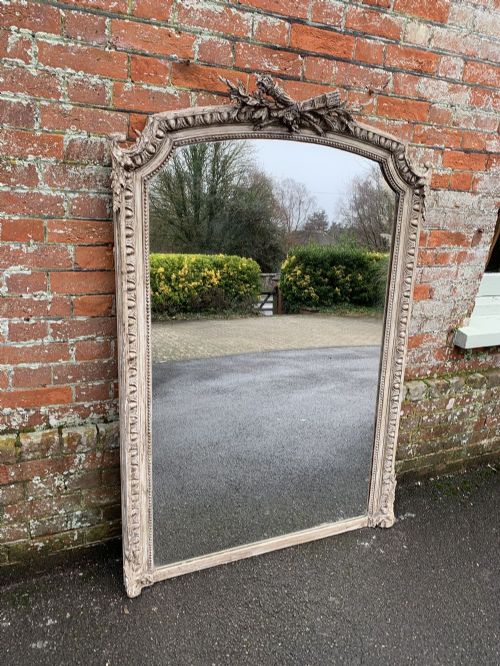 A Fabulous Large Antique French 19th Century Carved Wood and Gesso Shaped Top Mirror.