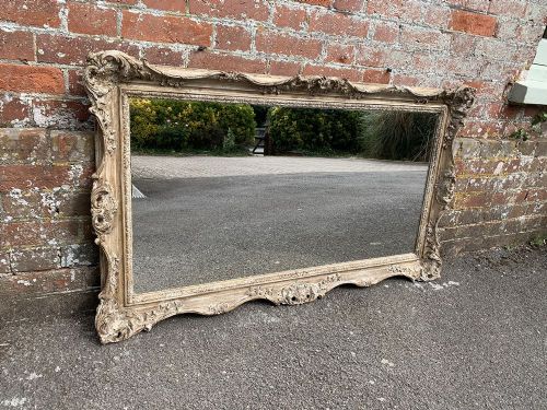 A Wonderful Early 20th Century French Carved Wood Distressed Painted Mirror.