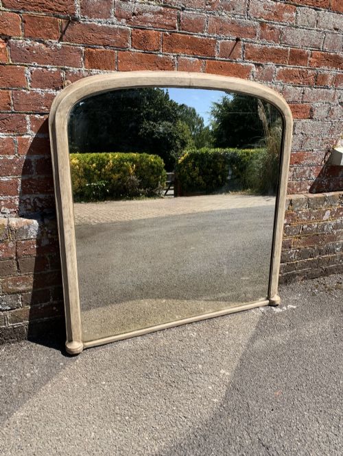 A Highly Useful Size Antique English 19th Century Carved Wood and Gesso Arched Top Painted Overmantle Mirror.