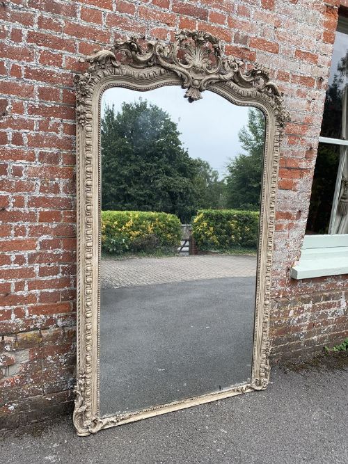 A Spectacular Large Antique French 19th Century Carved Wood and Gesso Shaped Top Painted Mirror.
