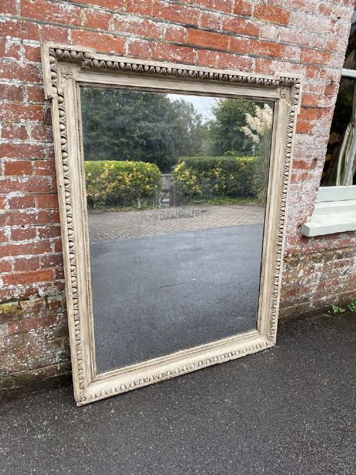 A Delightful Large Antique French 19th Century Carved Wood and Gesso Shaped Top Painted Mirror.