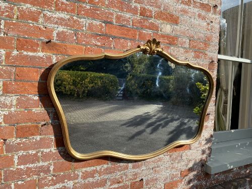 A Stunning Good Size French 20th Century Carved Wood Original Gilt Shaped Mirror.