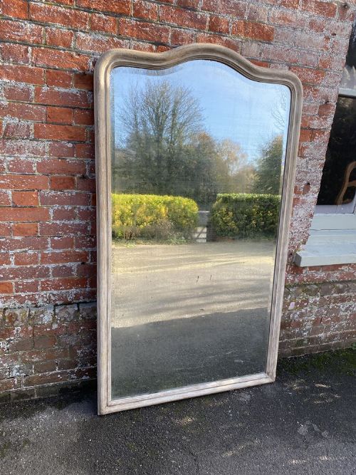 An Exceptional Large Antique French 19th Century Carved Wood and Gesso Shaped Top Painted Mirror.
