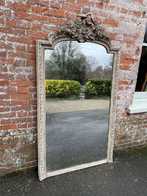 A Stunning Large Antique French 19th Century Carved Wood and Gesso Shaped Top Painted Mirror.