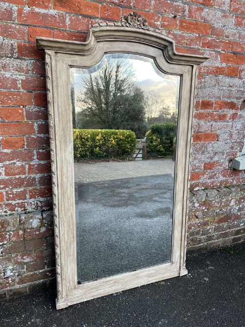 A Delightful Large Antique French 19th Century Carved Wood Shaped Top Painted Mirror.