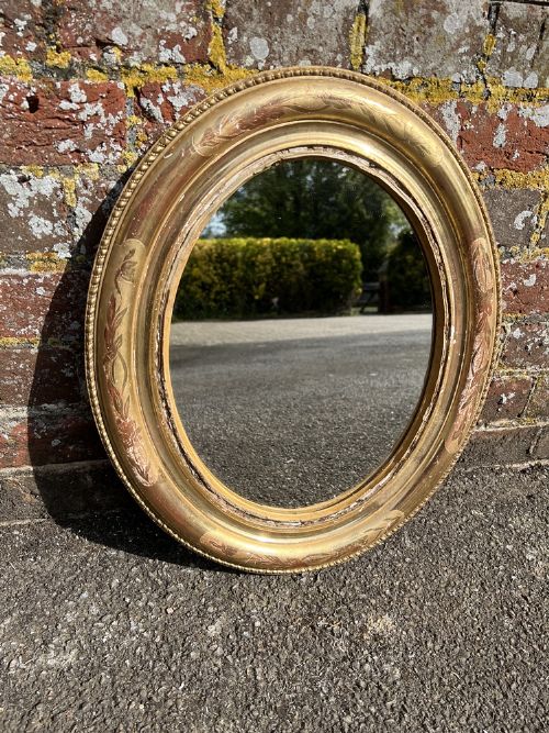 A Wonderful Useful Size Antique French 19th Century Gilt Oval Mirror.