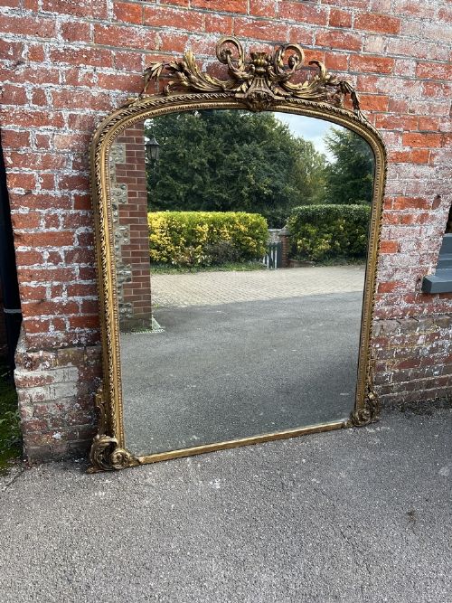 A Spectacular Large Antique English 19th Century Arched Top Gilt Overmantle Mirror.