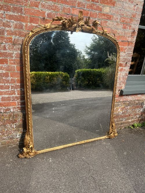 An Exceptional Large Antique English 19th Century Carved Wood & Gesso Arched Top Gilt Overmantle Mirror.