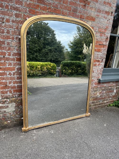 An Exceptional Large Antique English 19th Century Carved Wood & Gesso Arched Top Plain Gilt Overmantle Mirror.
