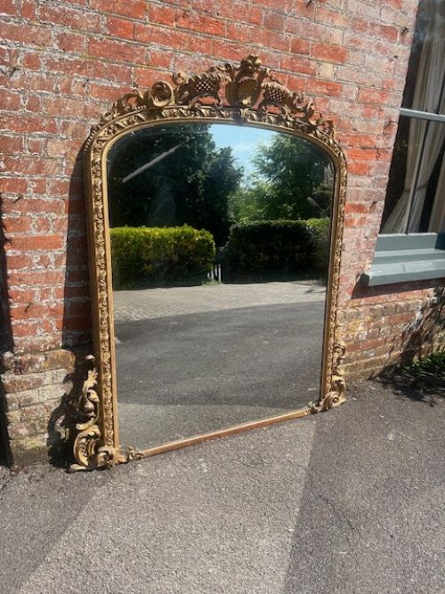 An Exceptional Large Antique English 19th Century Carved Wood & Gesso Arched Top Gilt Overmantle Mirror.