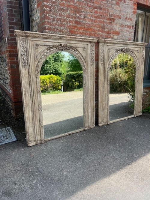 An Absolutely Spectacular Pair of Large Antique English 19th Century carved wood & gesso painted arched framed Overmantle Mirrors.