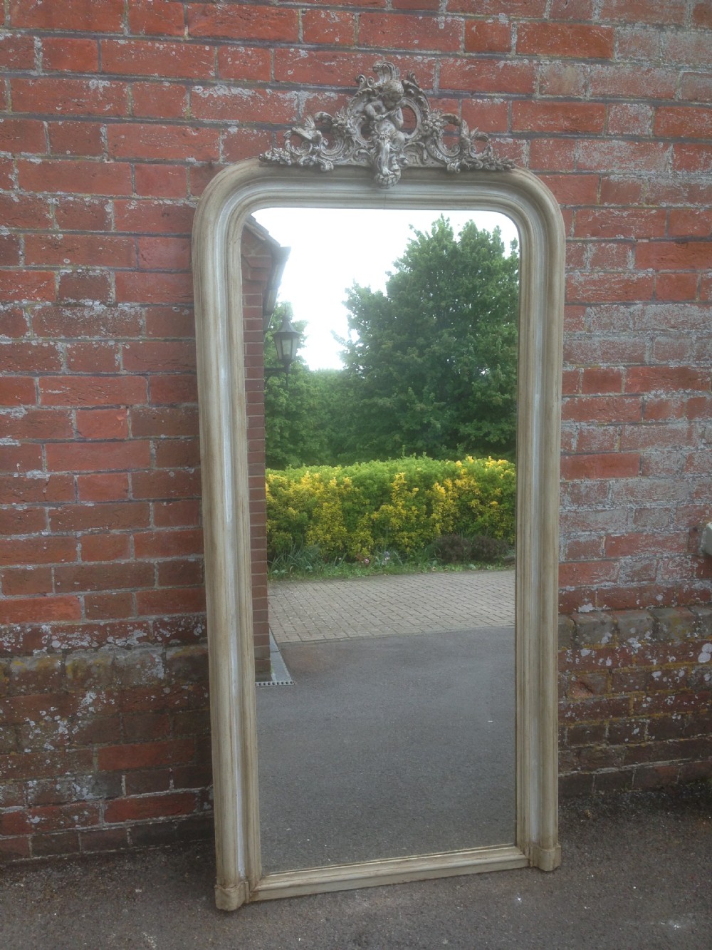 A Large Highly decorative Antique 19th Century French carved wood and gesso painted arched top Mirror.
