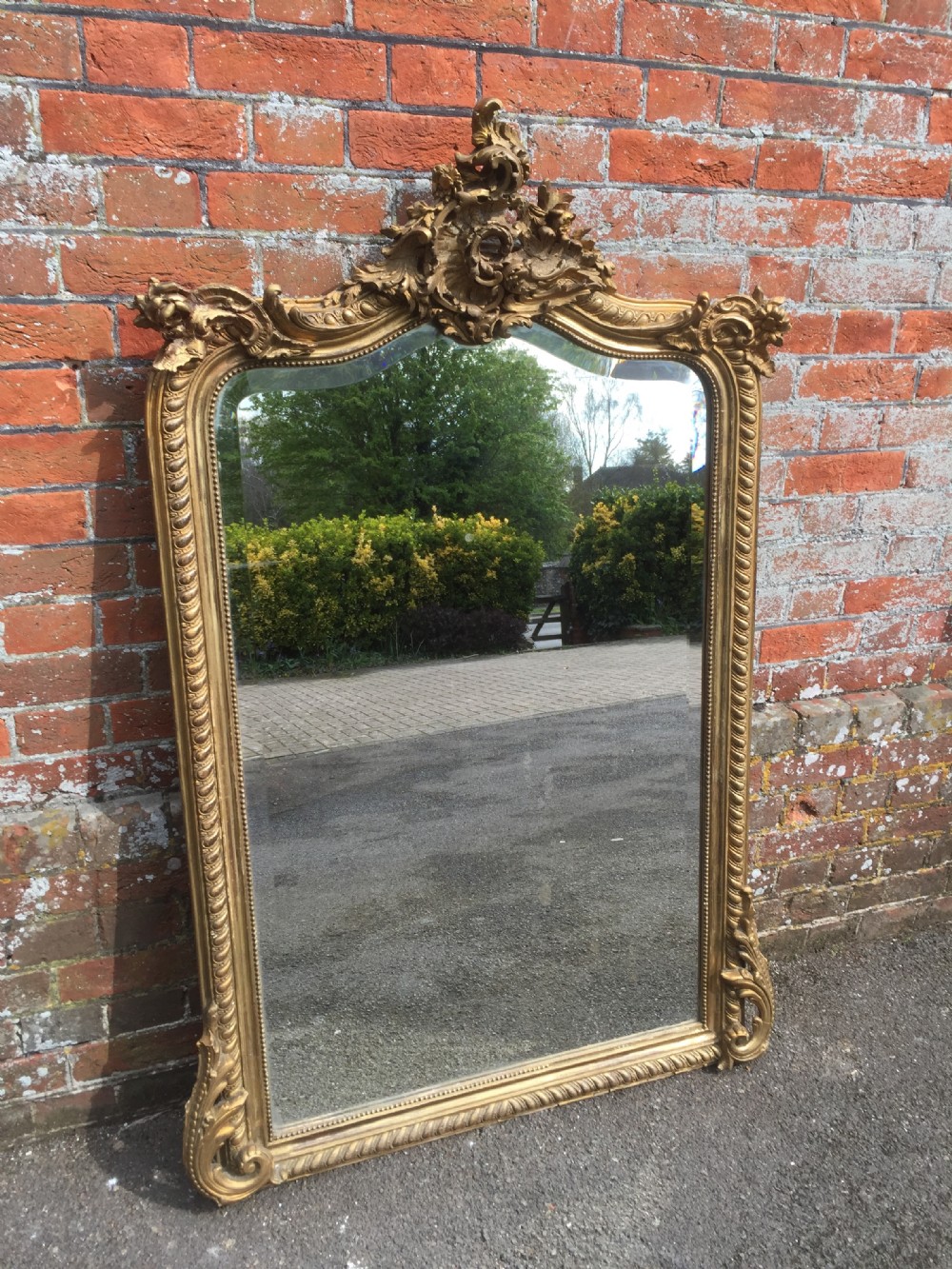 A Delightful Antique 19th Century French carved wood & gesso original shaped top gilt Mirror.