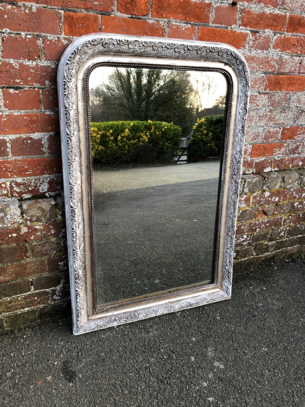 A Highly useful size Antique French 19th Century carved wood and gesso arched top original silvered and painted Mirror.