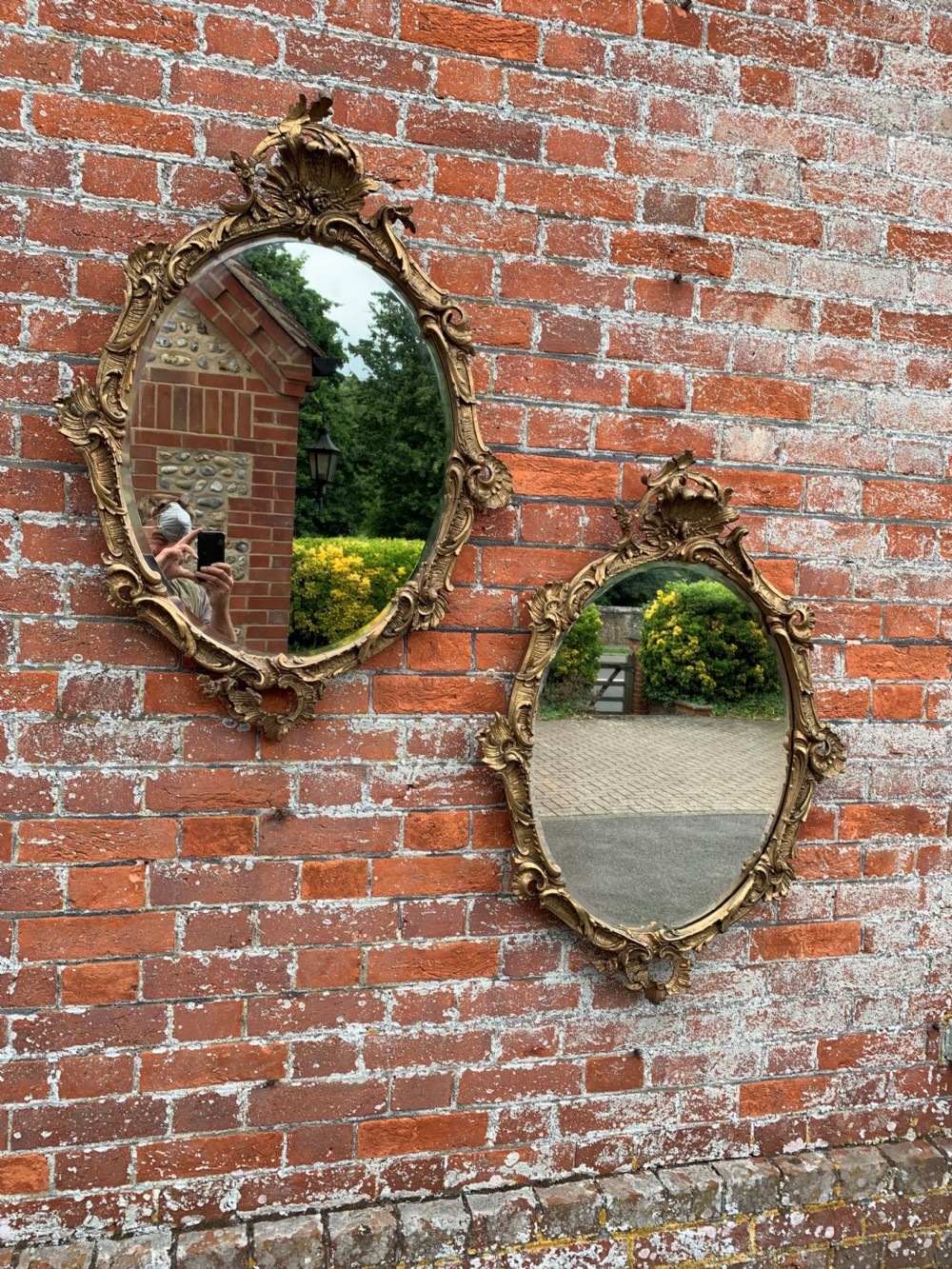 A Delightful Pair of Antique French 19th Century carved wood & gesso original gilt ornate slightly distressed Oval Mirrors. View IV