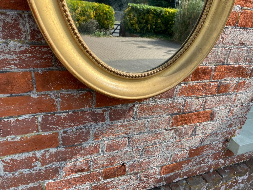 A Superb good size Antique French 19th Century carved wood & gesso original gilt Plain Oval Mirror. View IV