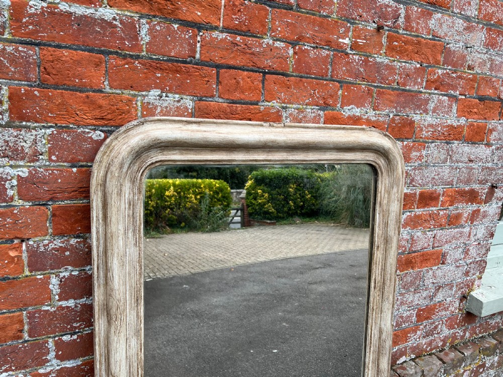 A large 19th-century French Louis Philippe mirror featuring an arched top rectangular frame with a distressed whitewashed wood finish. View III