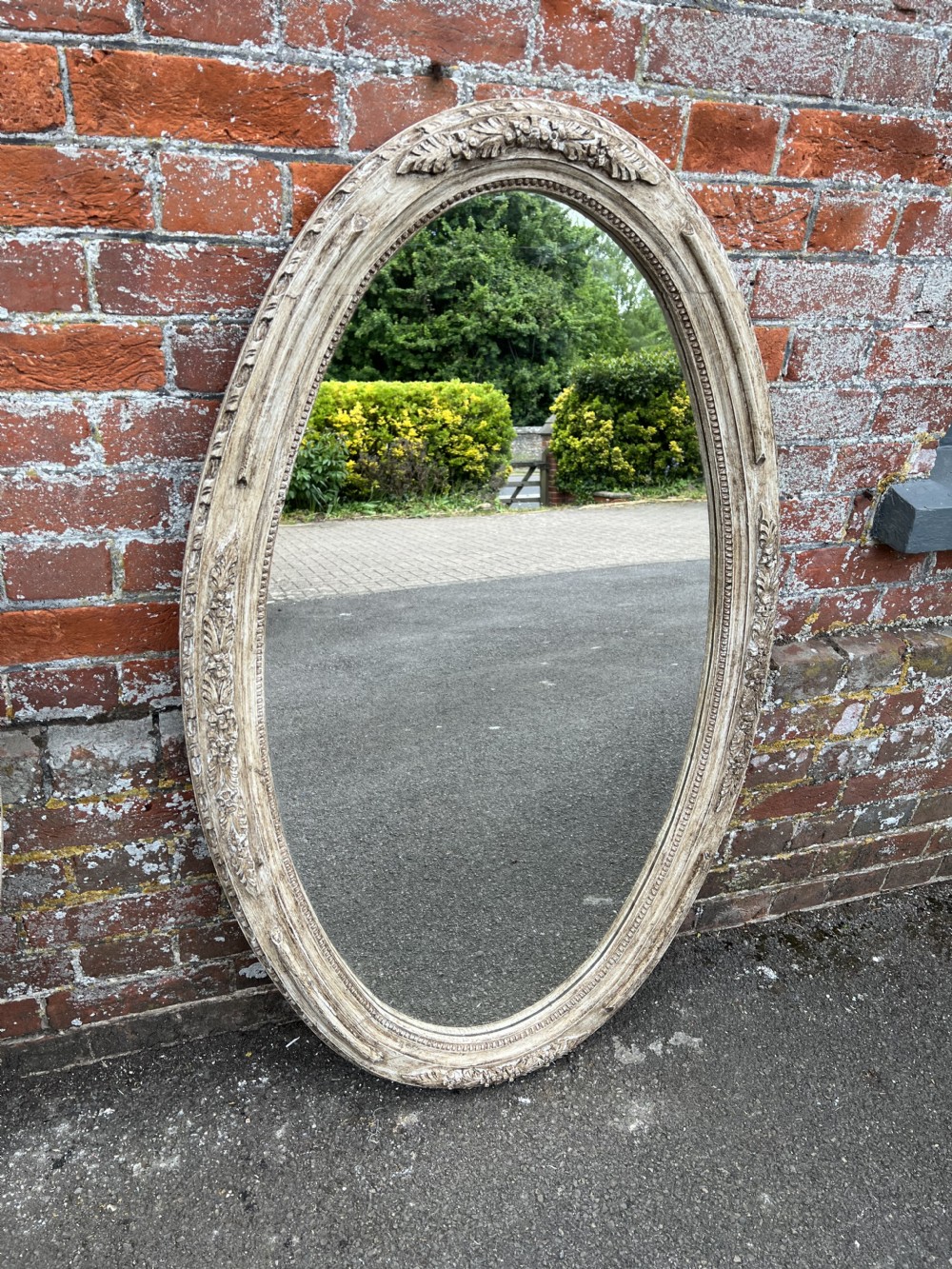 A Superb Pair of Antique French 19th Century carved wood painted Oval Mirrors. View II