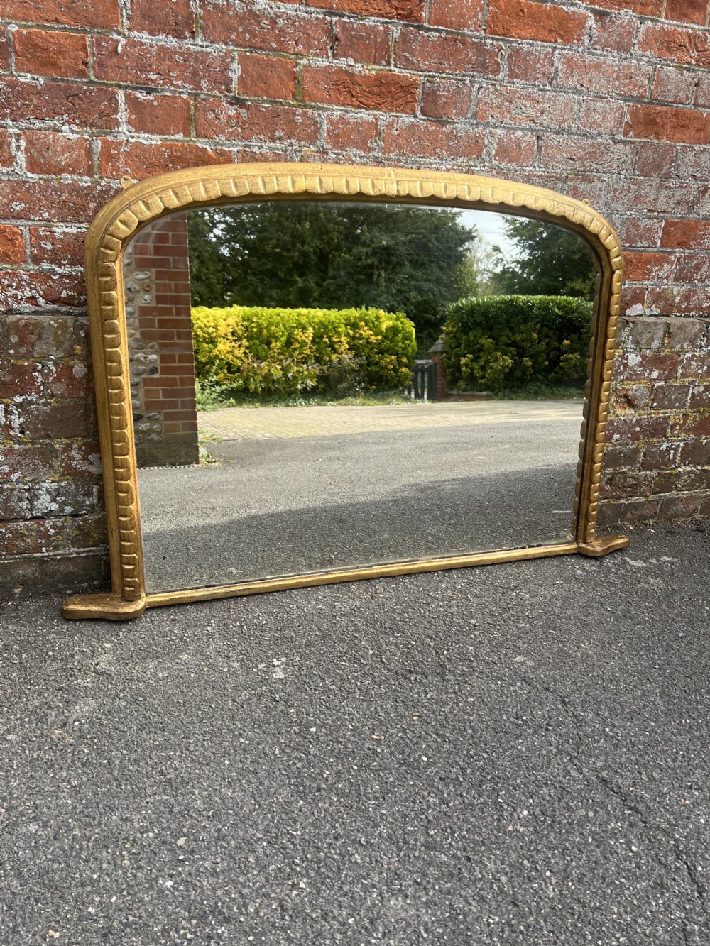 A Highly useful size Antique English 19th Century carved wood & gesso arched top gilt Overmantle Mirror.