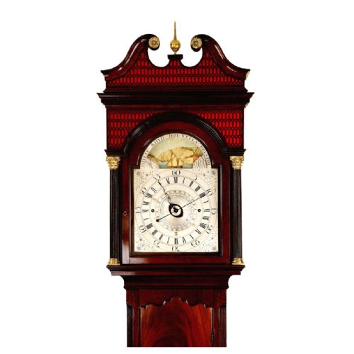 fig 1. A Georgian flame mahogany longcase clock featuring a swan-neck pediment, reeded columns, and an arching dial depicting a tidal scene.
