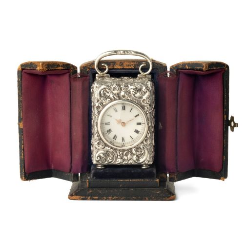 fig 1. A CHASED SILVER CASED TIMEPIECE BOUDOIR CARRIAGE CLOCK