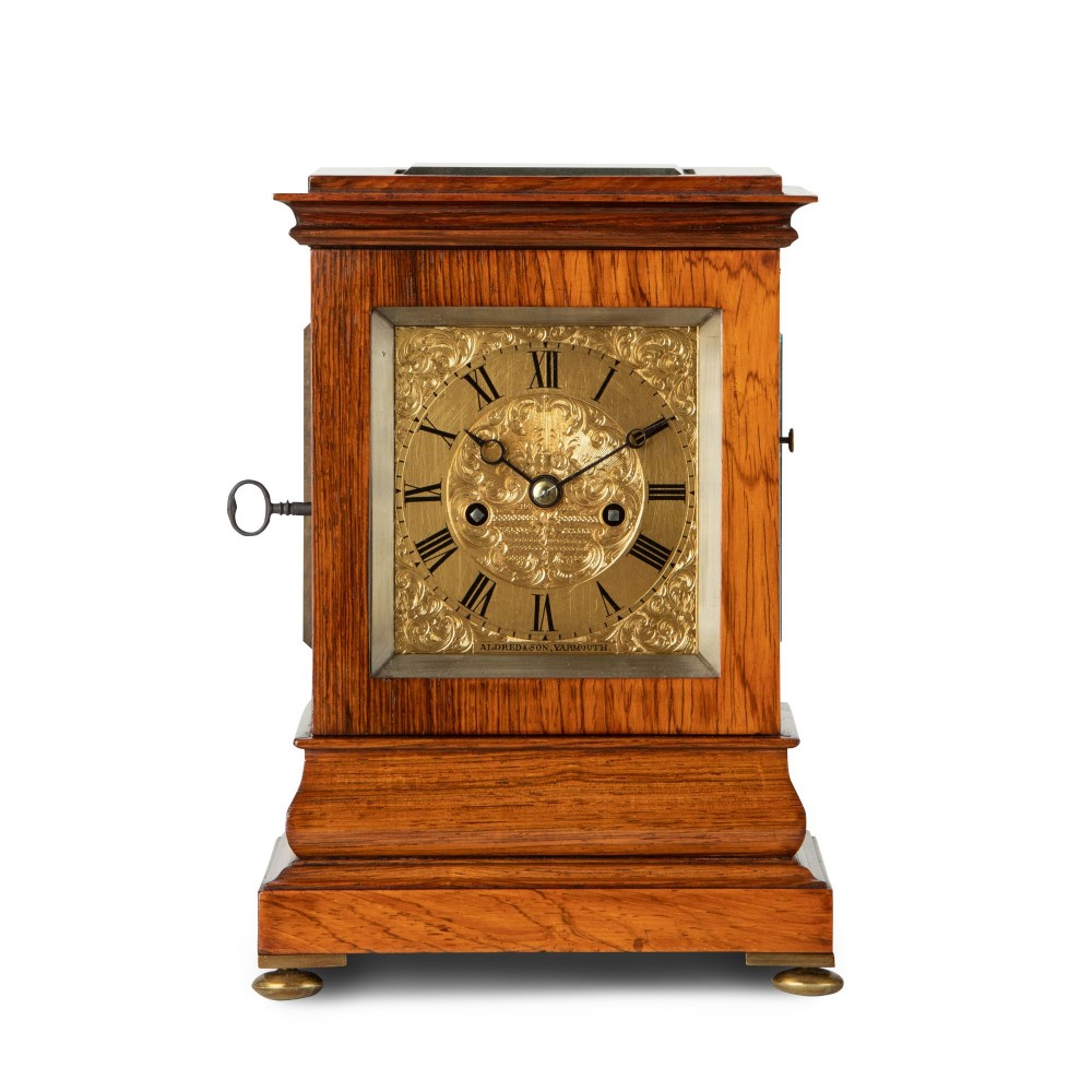 A FINE ROSEWOOD STRIKING AND REPEATING ‘ENGLISH FIVE GLASS’ LIBRARY CLOCK