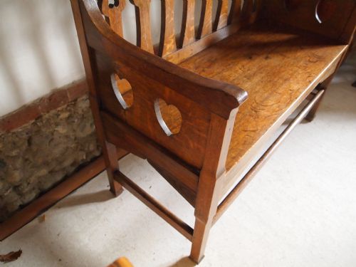 fig 2. Settle bench Shapland and Petter rare Oak motto settle c1900