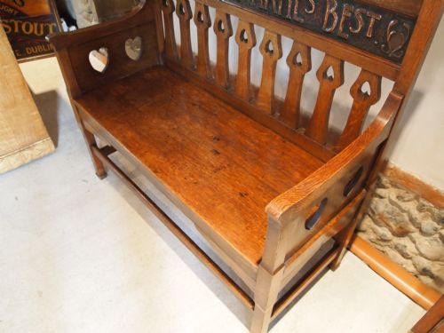 fig 4. Settle bench Shapland and Petter rare Oak motto settle c1900