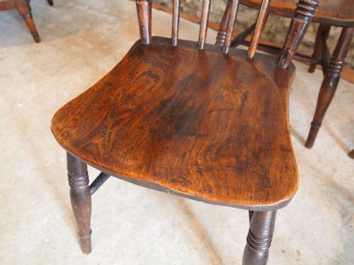 fig 1. Chairs a set of four Victorian Windsor Beech and Elm Roman spindle backs c1870