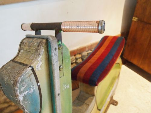 fig 1. Fairground ride 1950's scooter Brighton pier wooden carousel scooter
