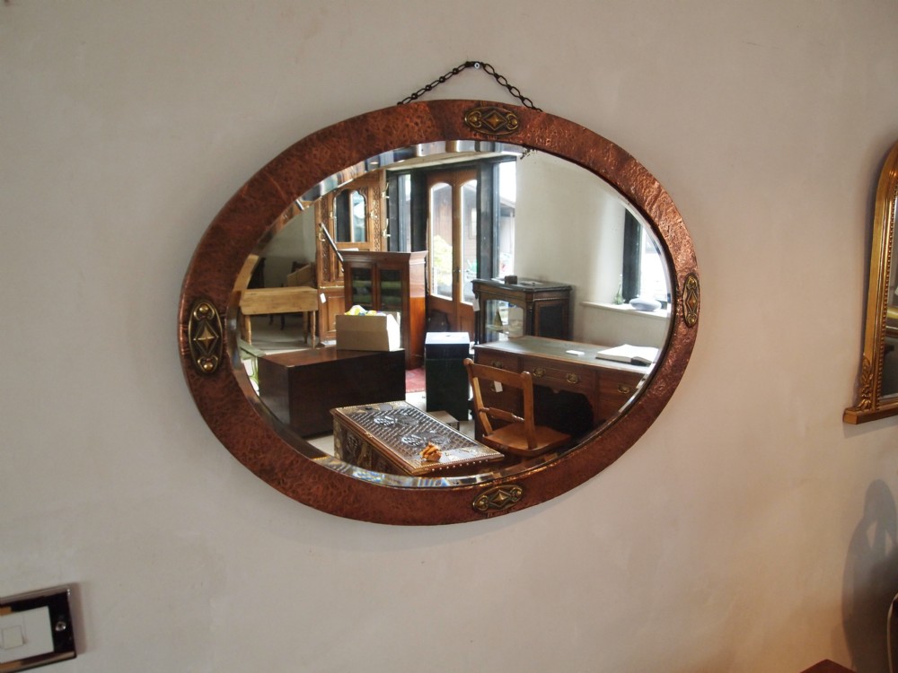 Mirror arts and crafts copper mirror with brass mounts c1900