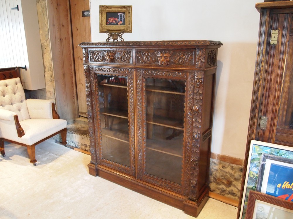 Bookcase Victorian carved Oak Green Man adjustable shelves c1880