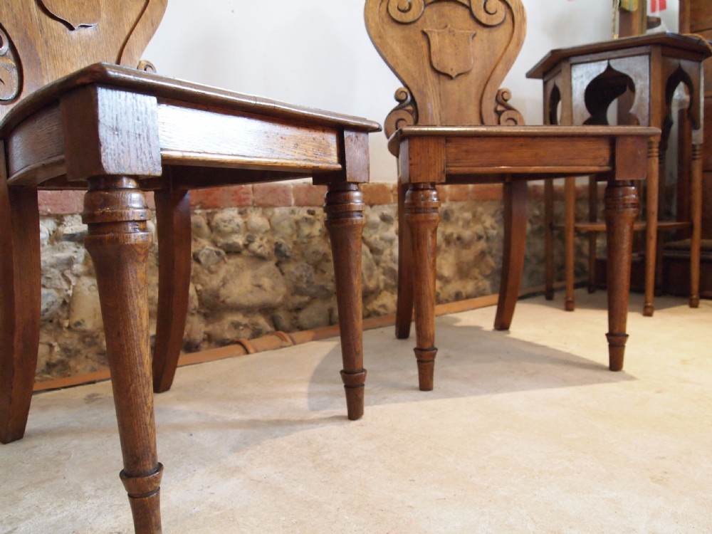 Chairs pair of William IV carved Oak hall chairs c1835 View VIII