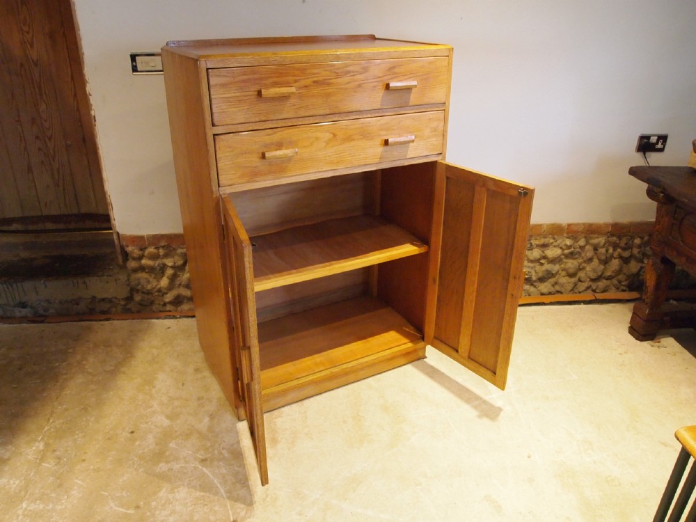 Tallboy cupboard chest of drawers in the manner of Heals Oak c1930 View IV