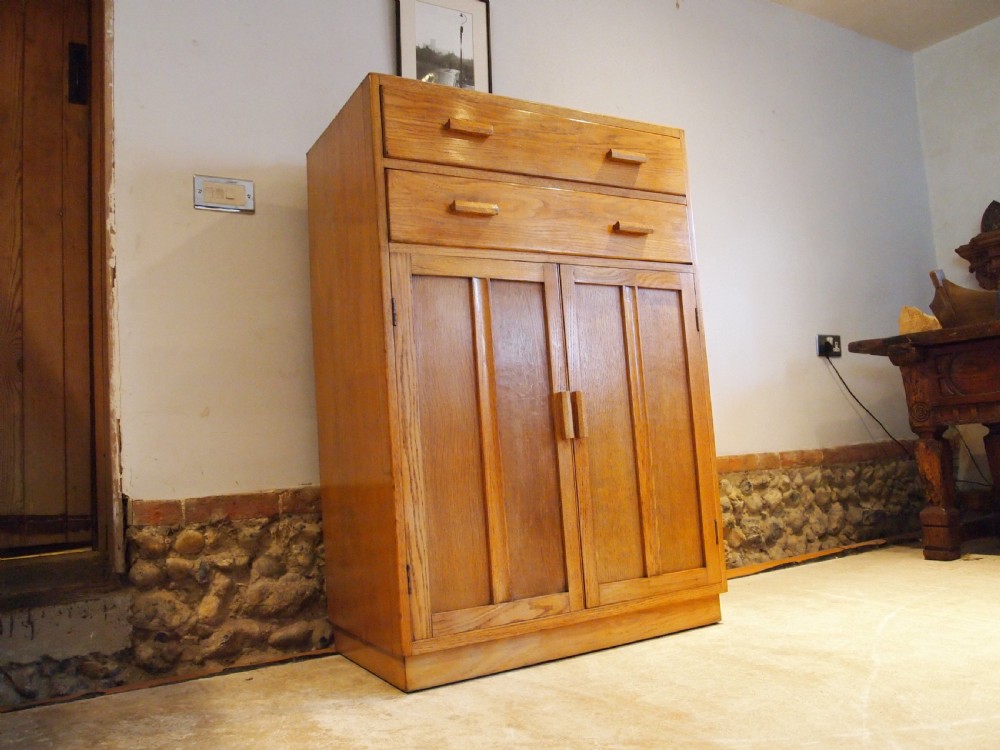 Tallboy cupboard chest of drawers in the manner of Heals Oak c1930 View VIII