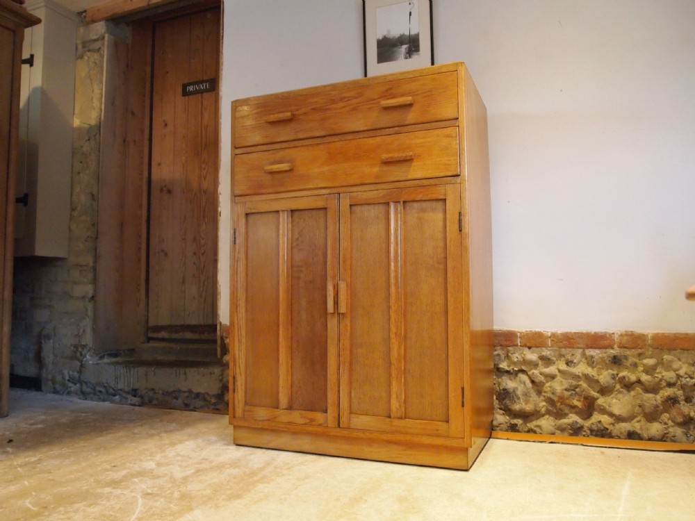 Tallboy cupboard chest of drawers in the manner of Heals Oak c1930 View X