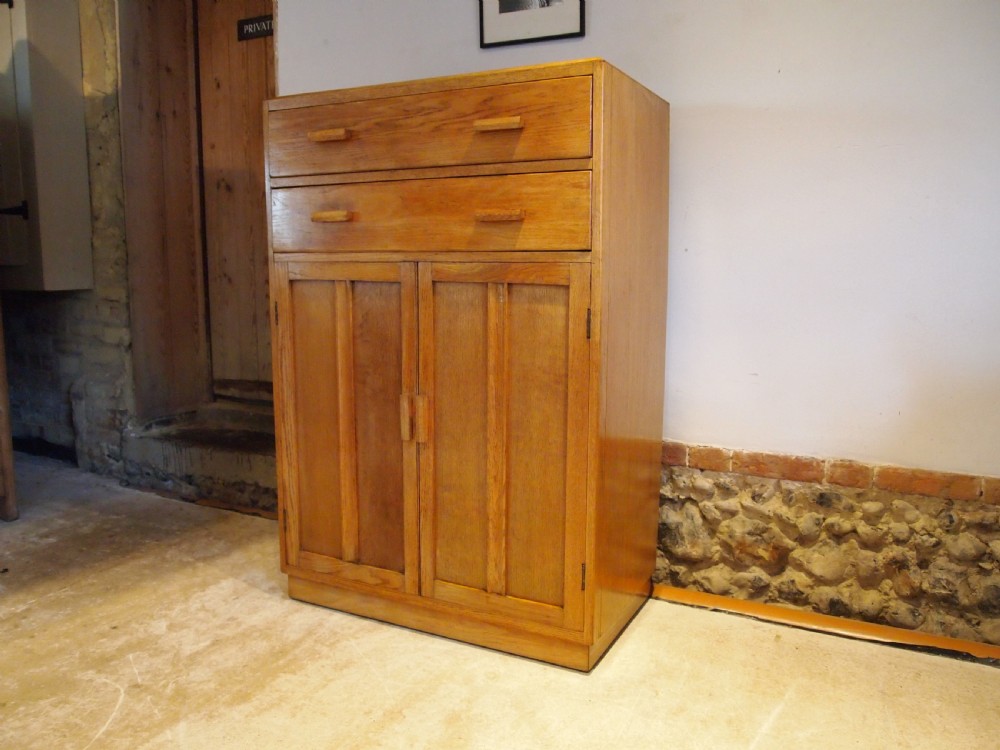 Tallboy cupboard chest of drawers in the manner of Heals Oak c1930 View XI
