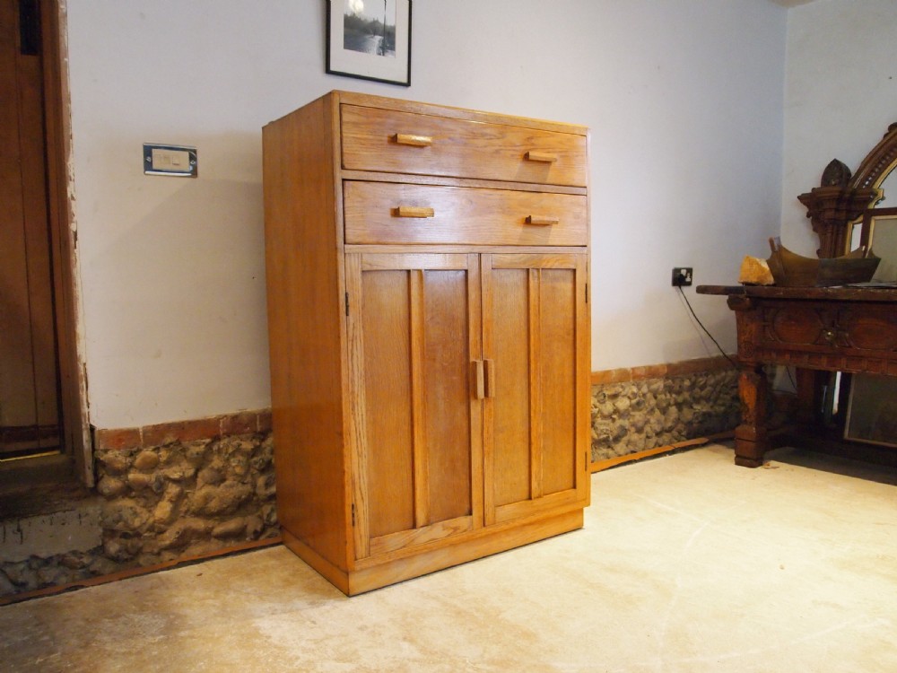 Tallboy cupboard chest of drawers in the manner of Heals Oak c1930 View XII