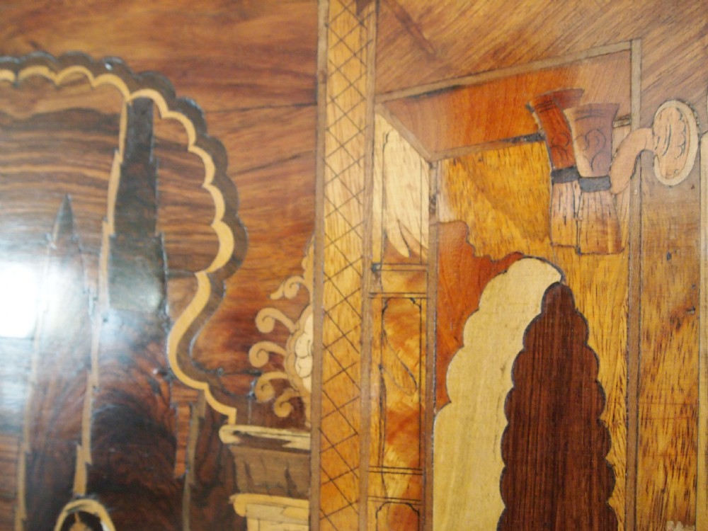 A large rectangular Indian specimen wood marquetry panel depicting a detailed court performance scene framed in dark polished wood. View VIII