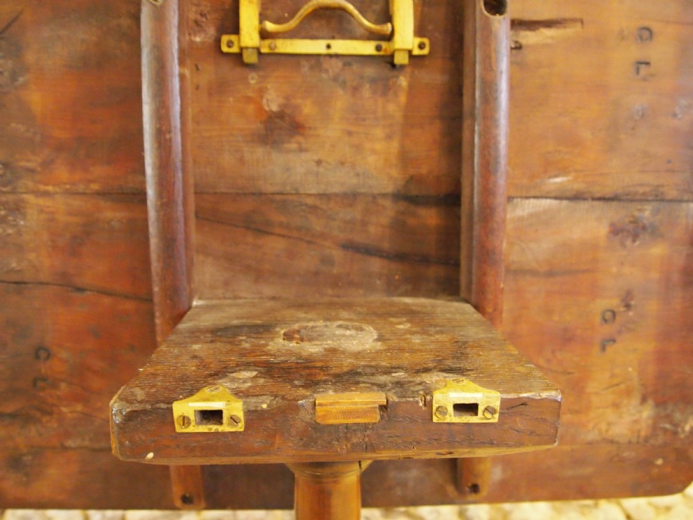 A George III yew wood tripod table featuring a rectangular top supported by a turned central column and three curved cabriole legs. View V