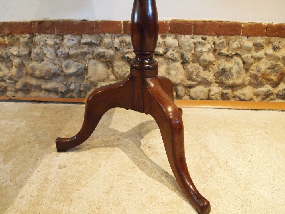 A George III yew wood tripod table featuring a rectangular top supported by a turned central column and three curved cabriole legs. View VII