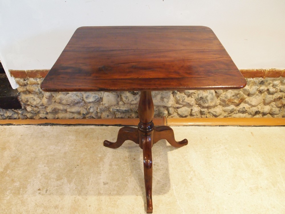 A George III yew wood tripod table featuring a rectangular top supported by a turned central column and three curved cabriole legs. View IX