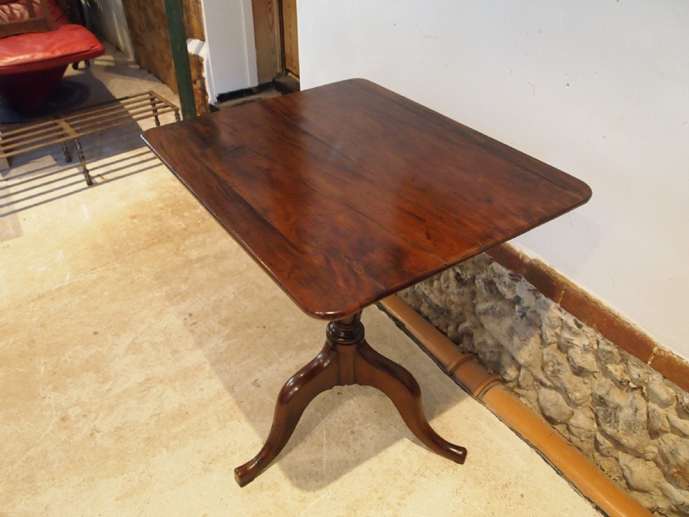 A George III yew wood tripod table featuring a rectangular top supported by a turned central column and three curved cabriole legs. View XI