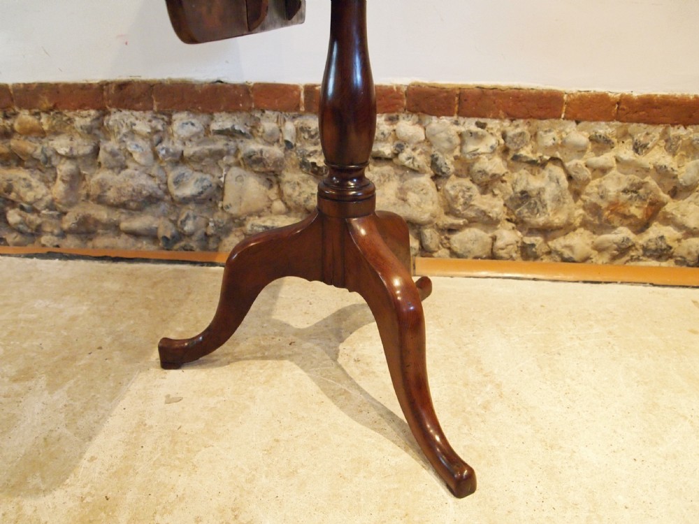 A George III yew wood tripod table featuring a rectangular top supported by a turned central column and three curved cabriole legs. View XVIII