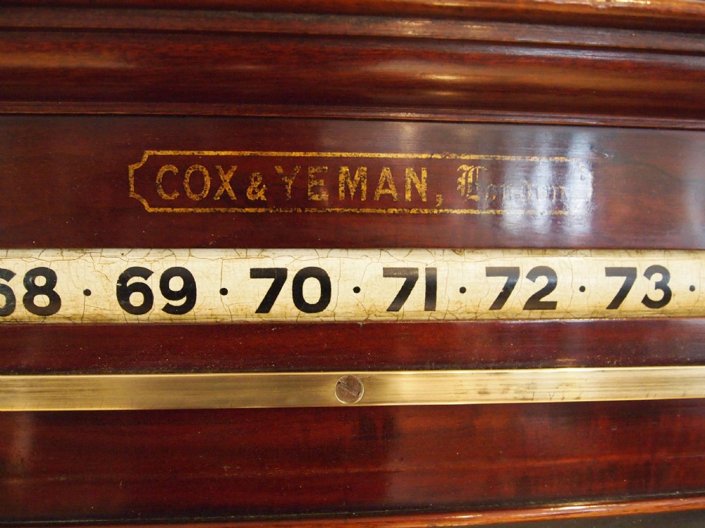 A Victorian mahogany snooker scoreboard featuring brass tracking rails, numbered rollers, a central chalkboard, and a glass-fronted lower cabinet. View II