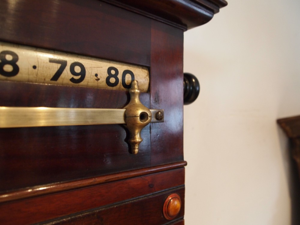 A Victorian mahogany snooker scoreboard featuring brass tracking rails, numbered rollers, a central chalkboard, and a glass-fronted lower cabinet. View IX