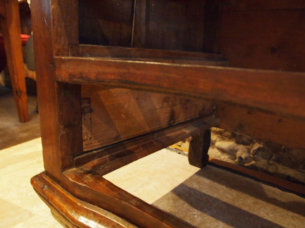 An 18th-century French walnut slant-front bureau desk featuring three wide drawers with ornamental brass handles and keyhole escutcheons. View II