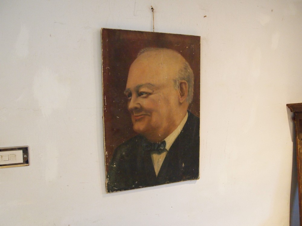 An unframed oil painting on canvas depicting a portrait of Sir Winston Churchill in profile against a dark brown background. View IV